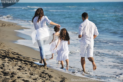 Image of happy young  family have fun on beach