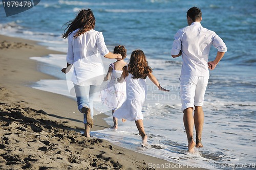 Image of happy young  family have fun on beach