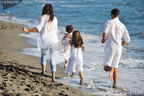 Image of happy young  family have fun on beach