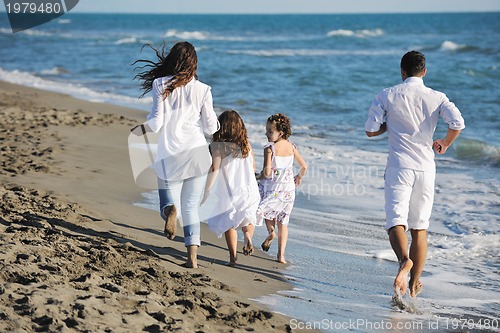 Image of happy young  family have fun on beach