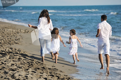 Image of happy young  family have fun on beach