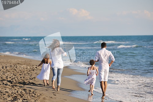 Image of happy young  family have fun on beach