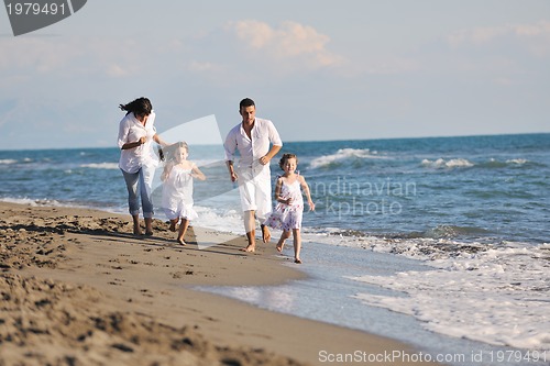 Image of happy young  family have fun on beach