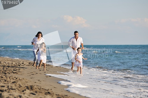 Image of happy young  family have fun on beach