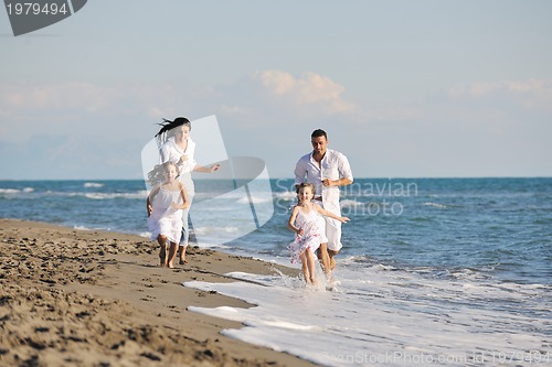 Image of happy young  family have fun on beach