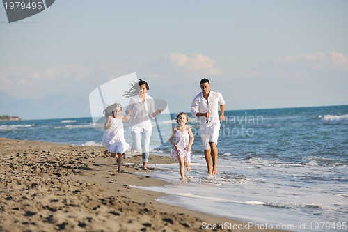 Image of happy young  family have fun on beach