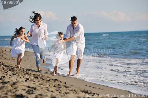 Image of happy young  family have fun on beach