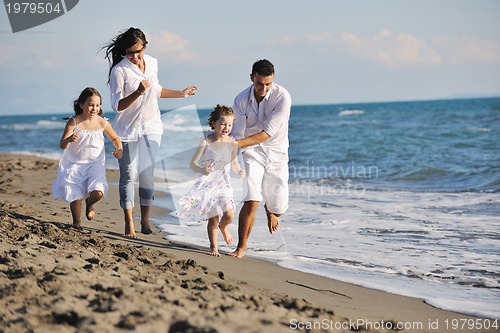 Image of happy young  family have fun on beach
