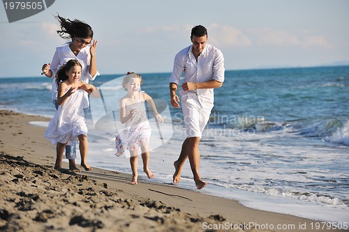 Image of happy young  family have fun on beach