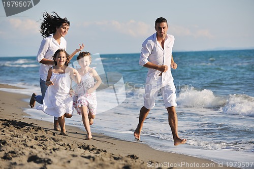 Image of happy young  family have fun on beach