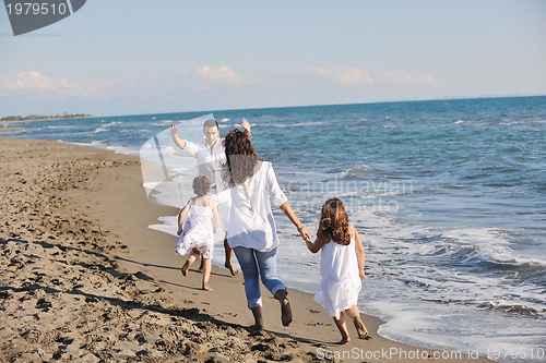 Image of happy young  family have fun on beach