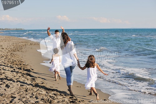 Image of happy young  family have fun on beach