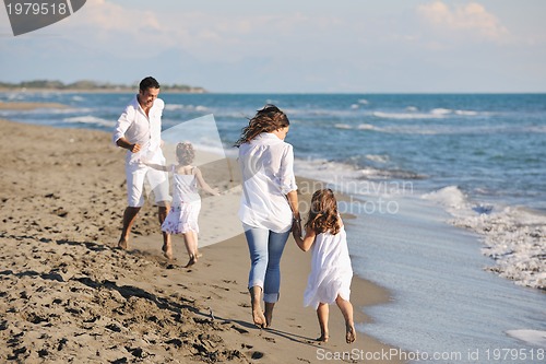 Image of happy young  family have fun on beach