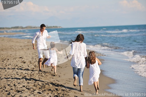 Image of happy young  family have fun on beach