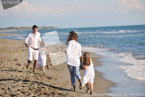Image of happy young  family have fun on beach