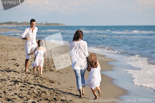 Image of happy young  family have fun on beach