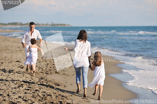 Image of happy young  family have fun on beach