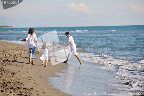 Image of happy young  family have fun on beach
