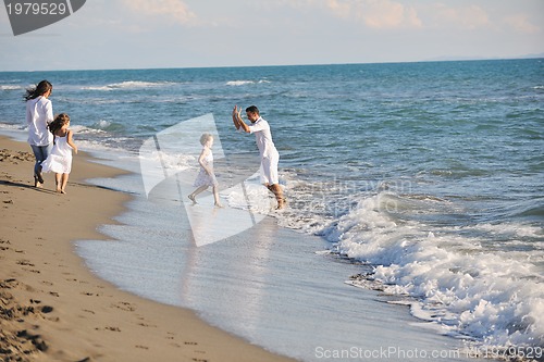 Image of happy young  family have fun on beach