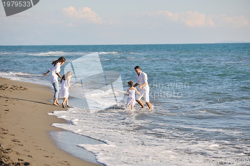 Image of happy young  family have fun on beach