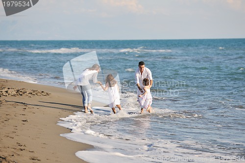 Image of happy young  family have fun on beach