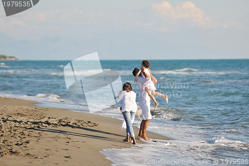 Image of happy young  family have fun on beach