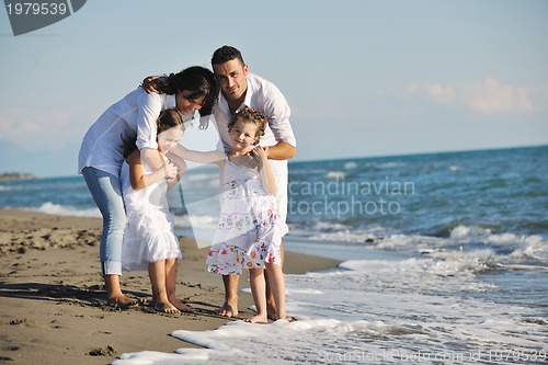 Image of happy young  family have fun on beach