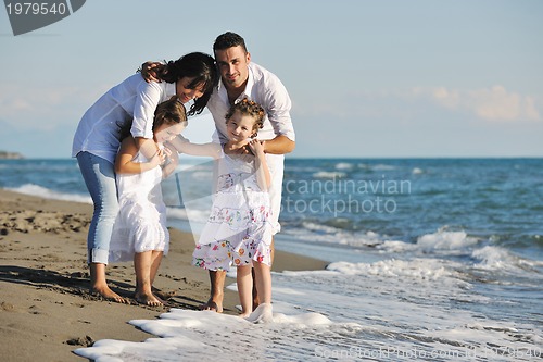 Image of happy young  family have fun on beach