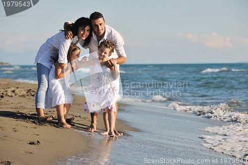 Image of happy young  family have fun on beach
