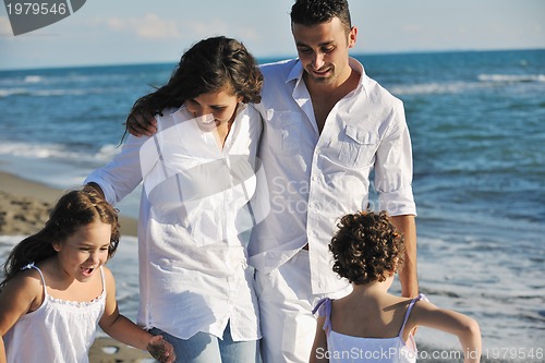 Image of happy young  family have fun on beach
