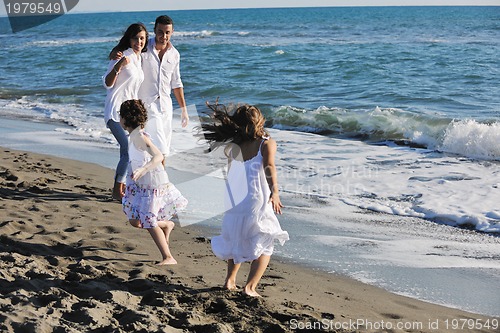Image of happy young  family have fun on beach