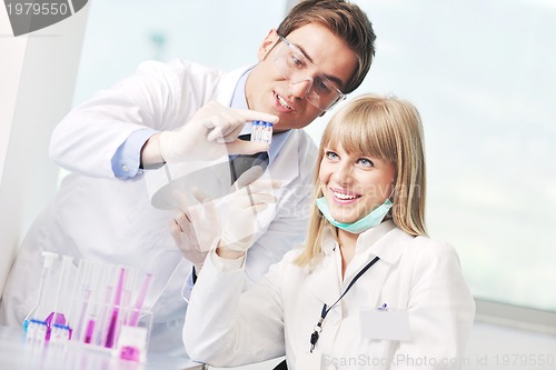 Image of science people in bright lab