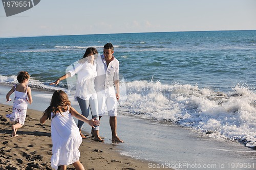 Image of happy young  family have fun on beach