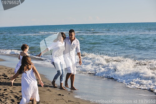 Image of happy young  family have fun on beach