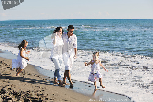 Image of happy young  family have fun on beach
