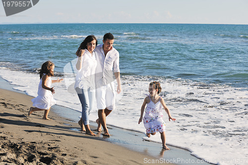 Image of happy young  family have fun on beach