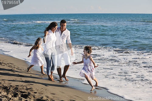 Image of happy young  family have fun on beach