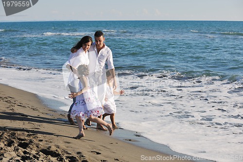 Image of happy young  family have fun on beach