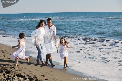 Image of happy young  family have fun on beach