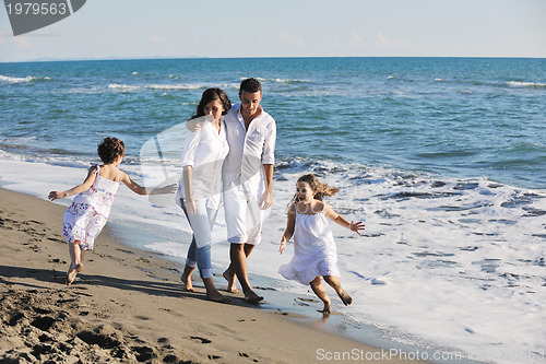 Image of happy young  family have fun on beach