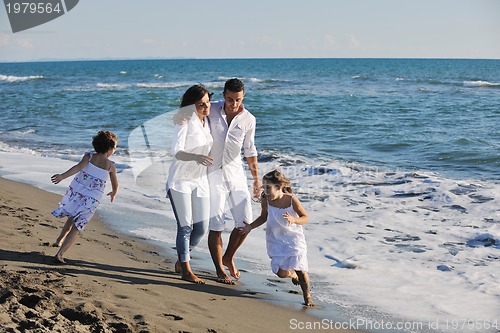 Image of happy young  family have fun on beach