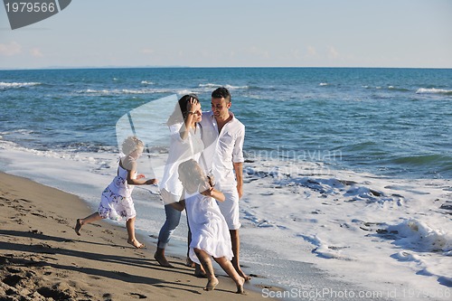 Image of happy young  family have fun on beach