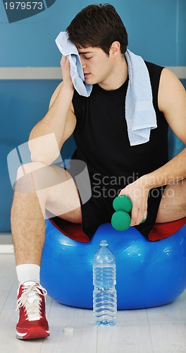 Image of man drink water at fitness workout