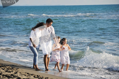 Image of happy young  family have fun on beach