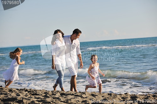 Image of happy young  family have fun on beach
