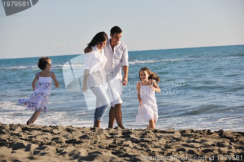 Image of happy young  family have fun on beach