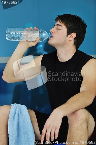 Image of man drink water at fitness workout