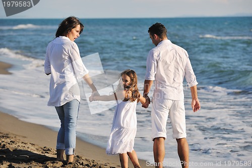 Image of happy young  family have fun on beach
