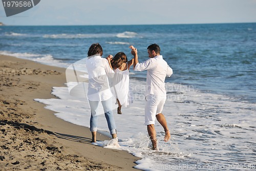 Image of happy young  family have fun on beach