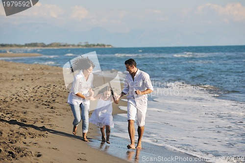 Image of happy young  family have fun on beach